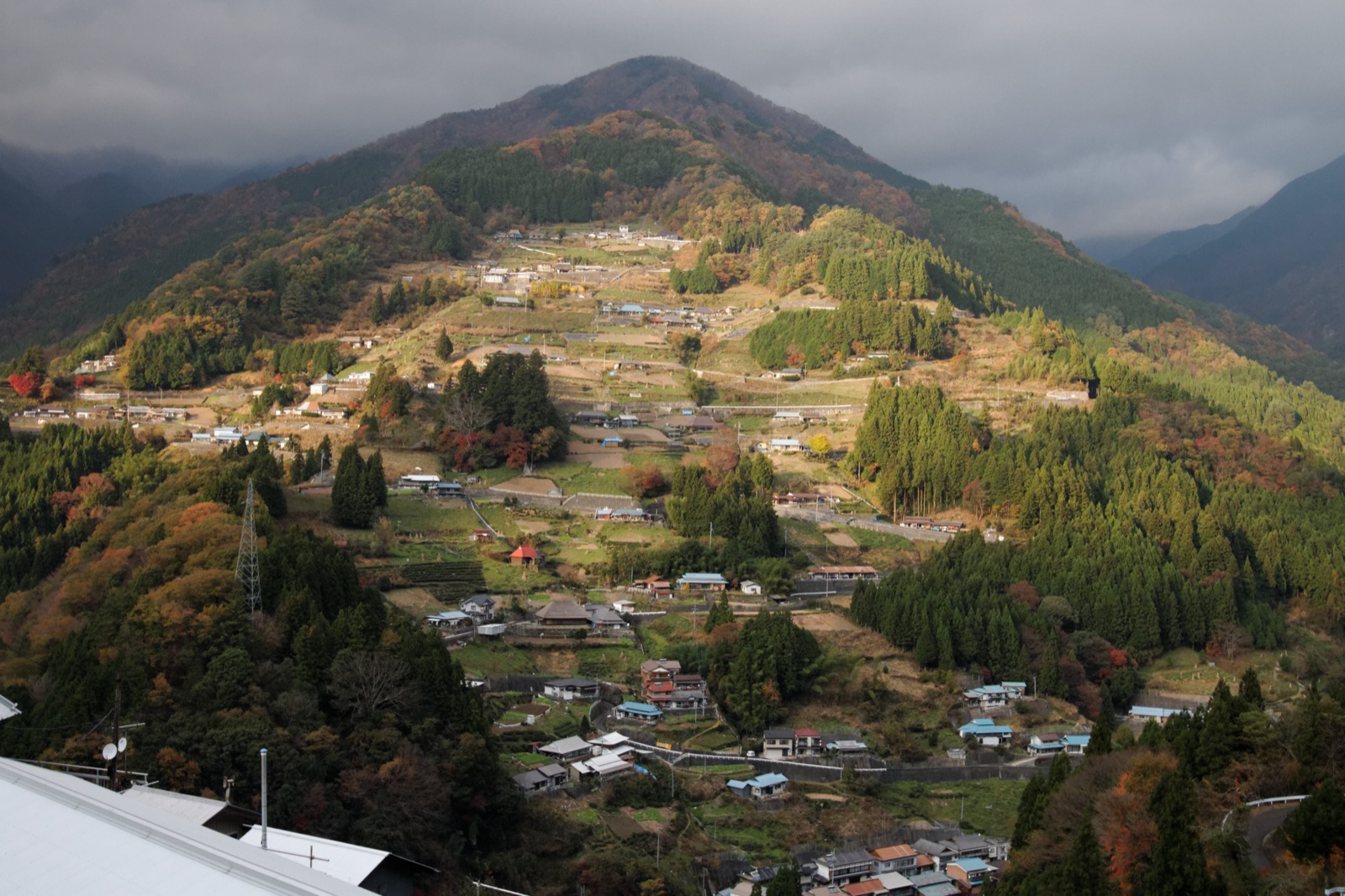 Ochiai hamlet, houses and fields terraced up a steep mountainside in Iya
